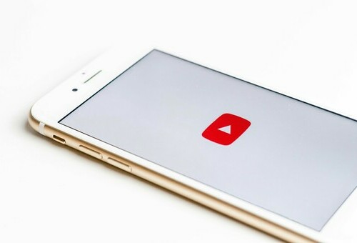 Picture of the youtube play button on a phone